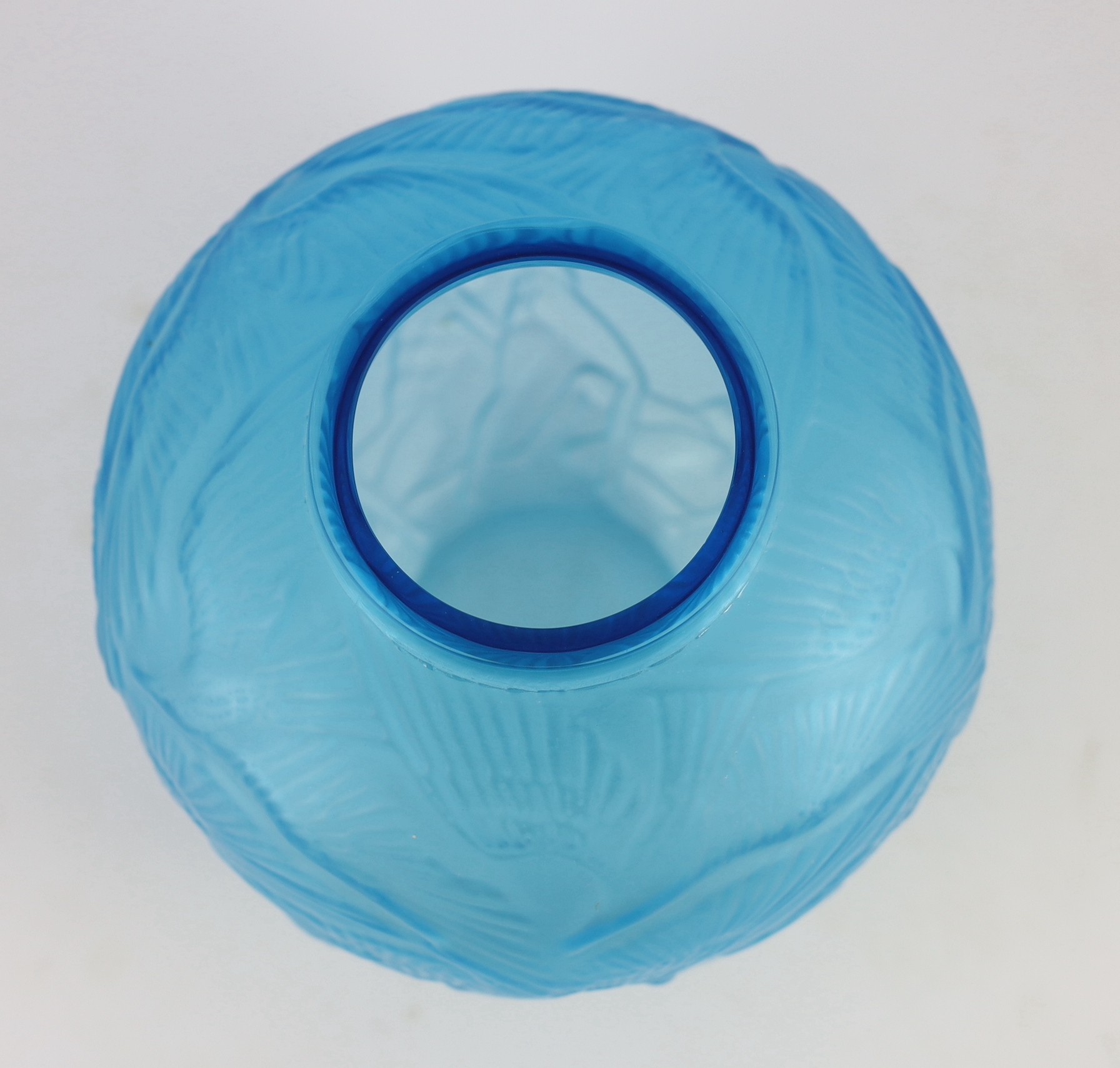 A Lalique style Archers pattern blue glass vase, 26cms high